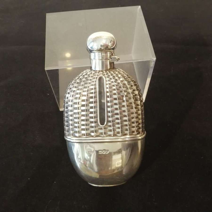 An outstanding and unusual silver hip flask