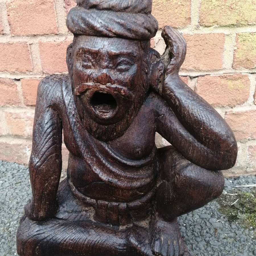 An interesting carved figure of a religious guru