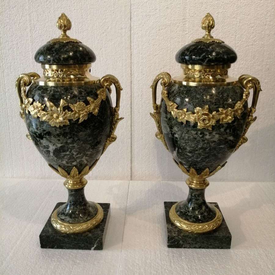 A beautiful pair of marble cassolettes