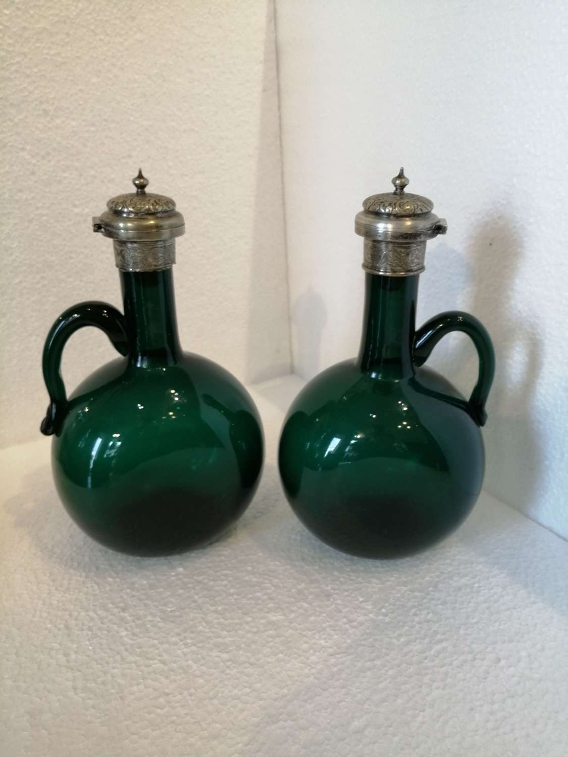 A pair of 19th century Bristol green glass flagons