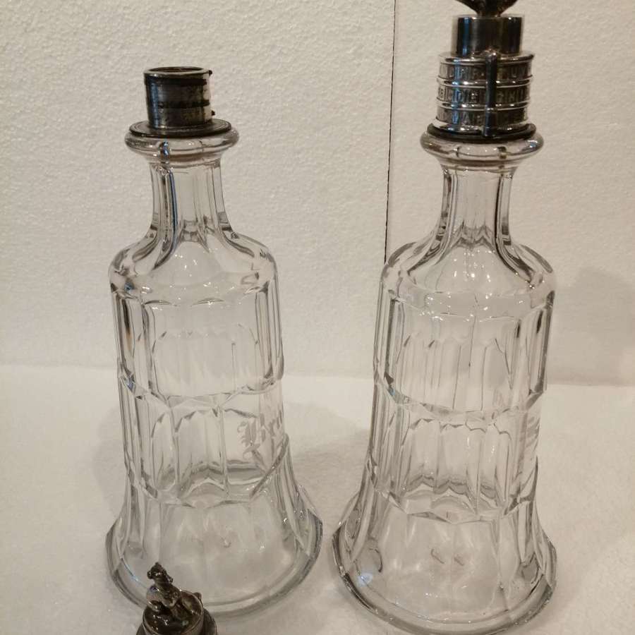 A rare pair of 19th century combination lock top decanters