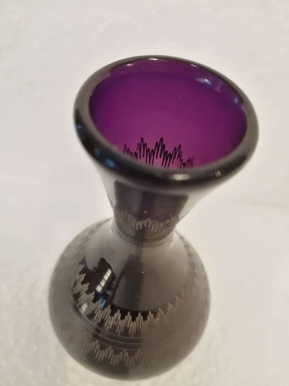 An exquisite small Georgian amethyst glass vase