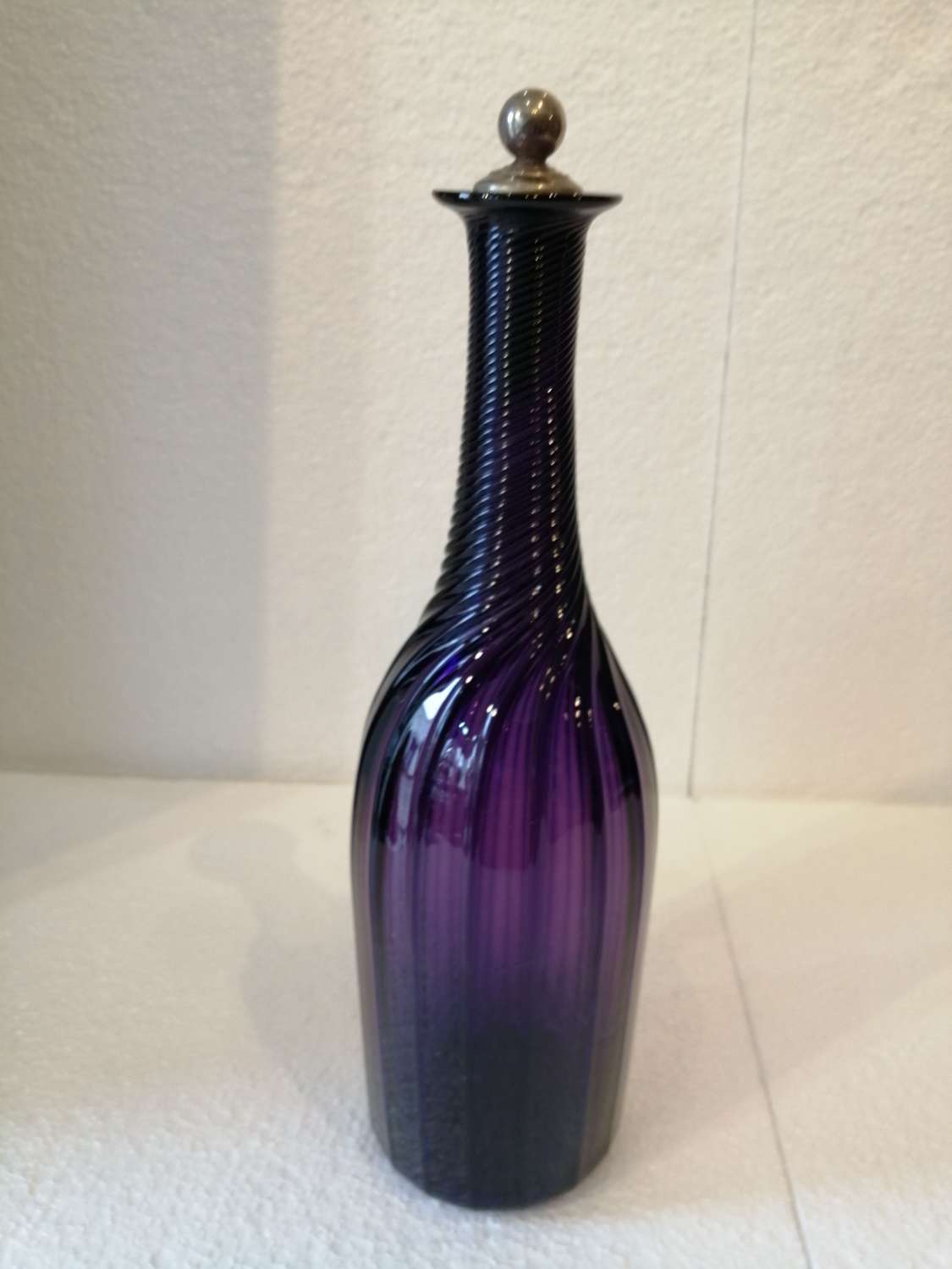 A 19th century amethyst ribbed serving bottle