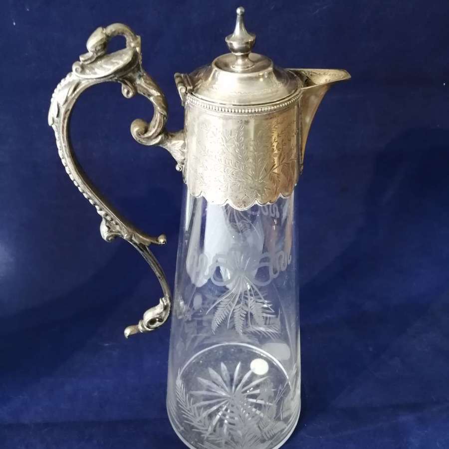 A fine quality 19th century engraved glass and silver plate claret jug