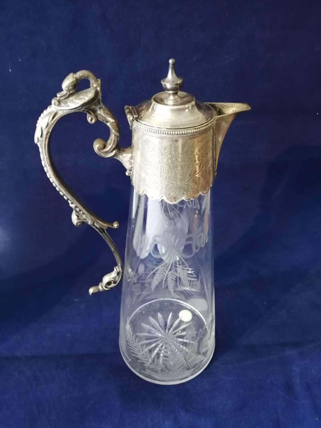 A fine quality 19th century engraved glass and silver plate claret jug