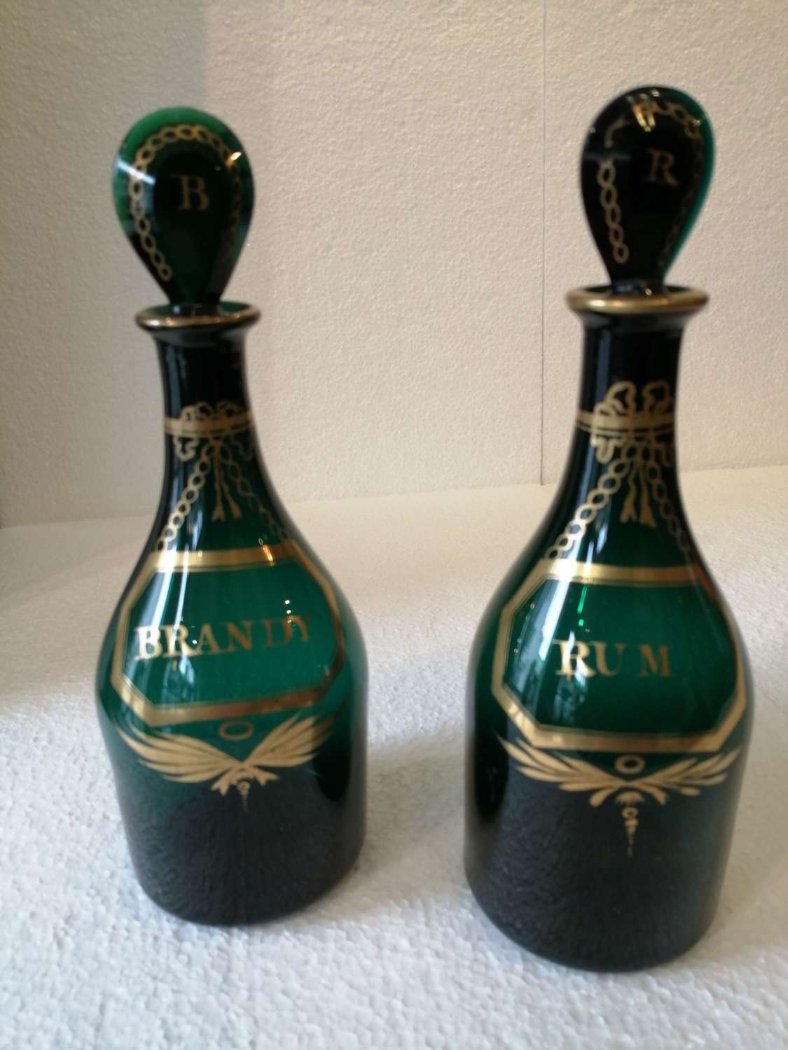 A superb pair of Georgian Bristol green decanters