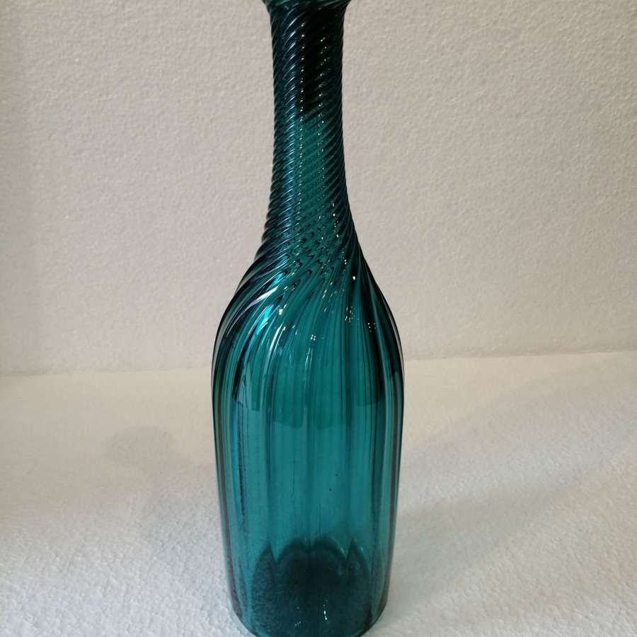 A 19th century  peacock blue ribbed wine bottle