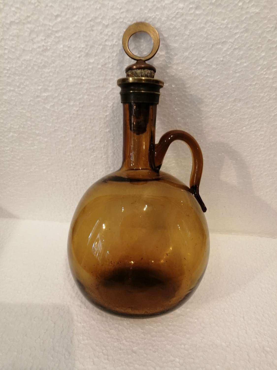A late Georgian hand blown Amber Glass Flagon Decanter
