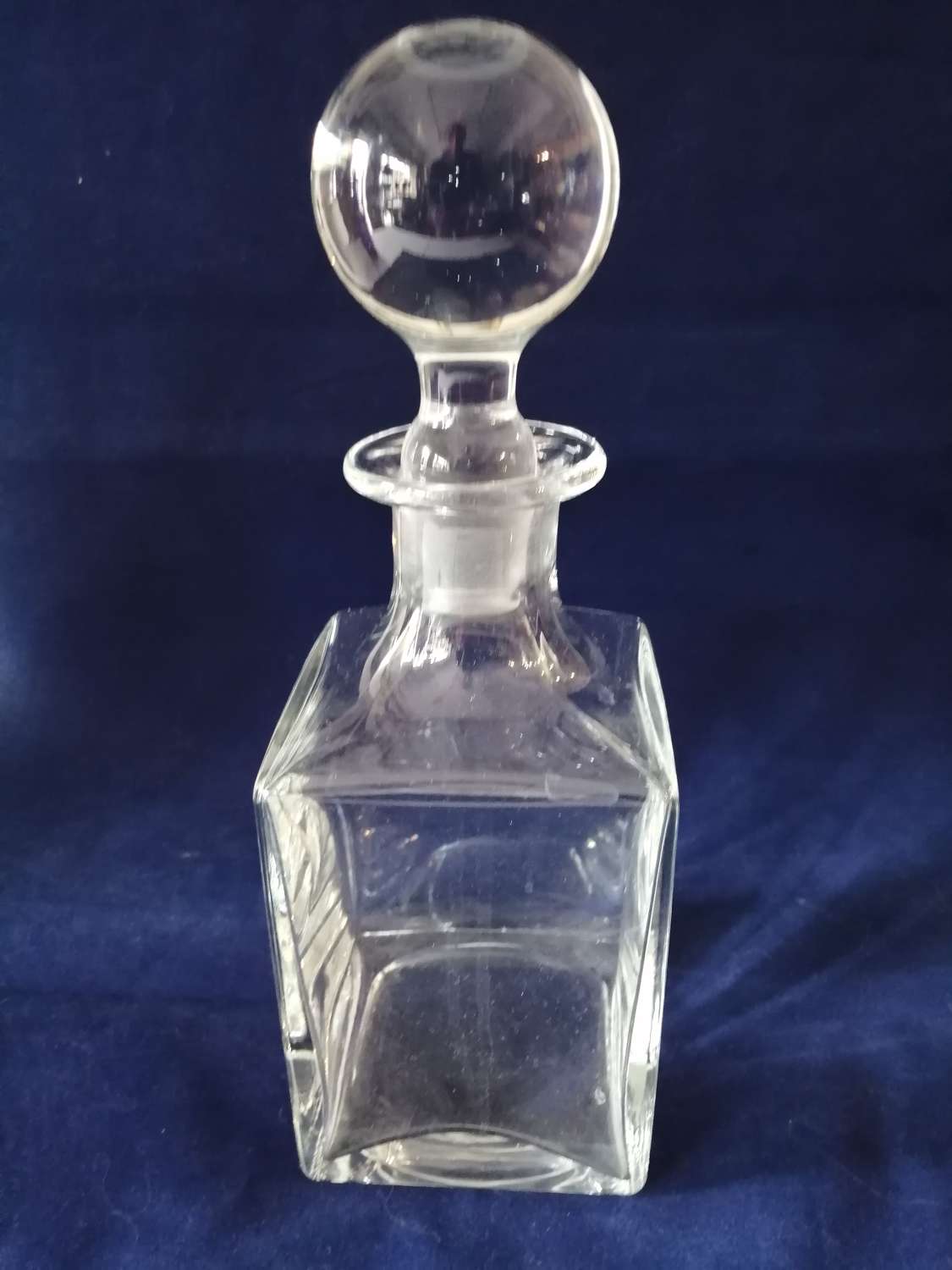 An Art Deco square glass whiskey decanter