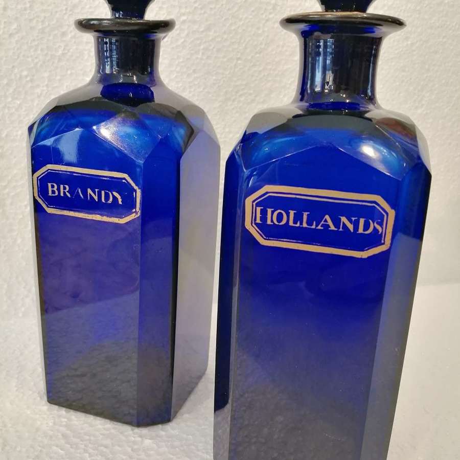 A beautiful pair of Bristol Blue square section decanters