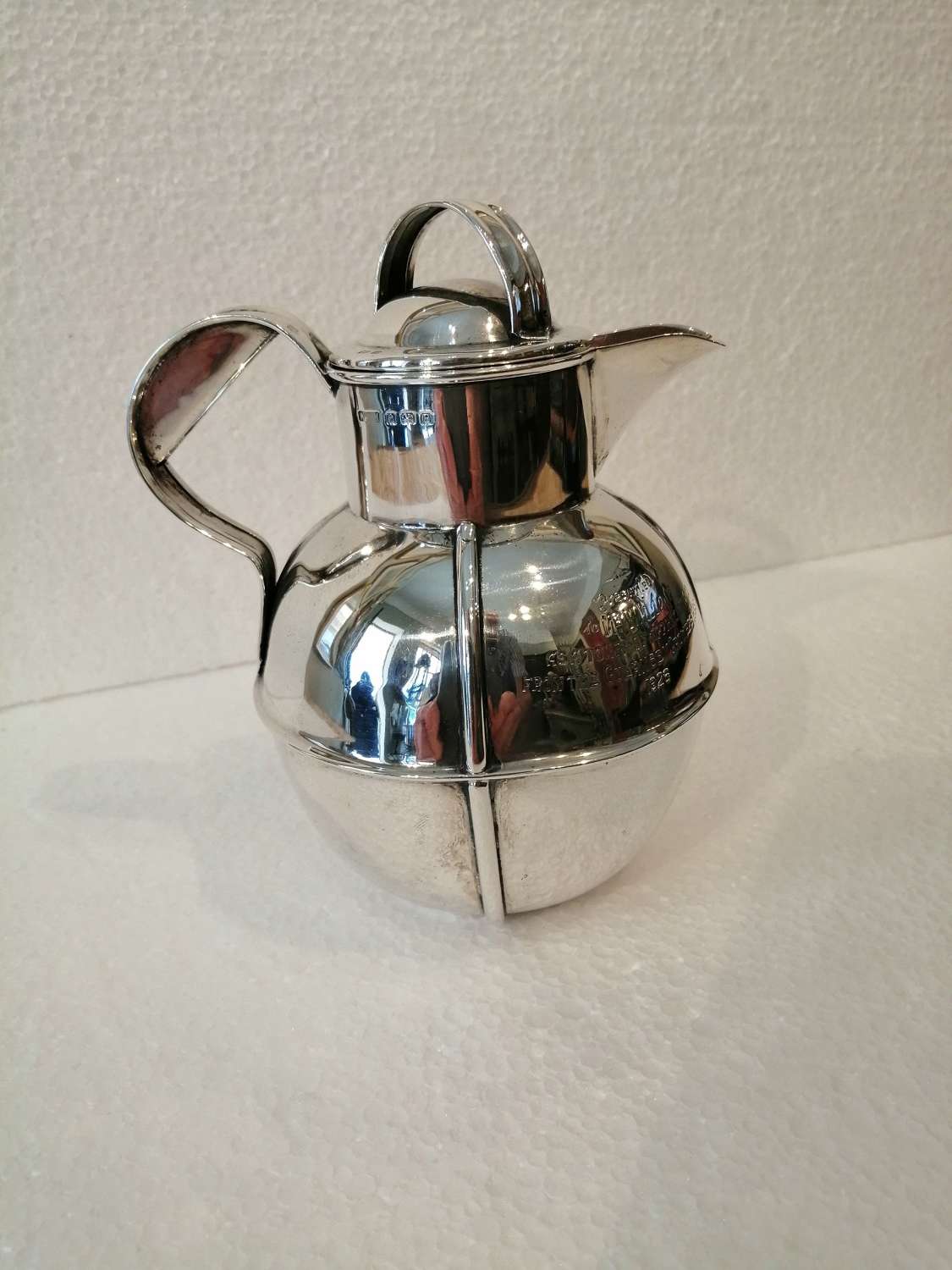 A silver Jersey cream jug