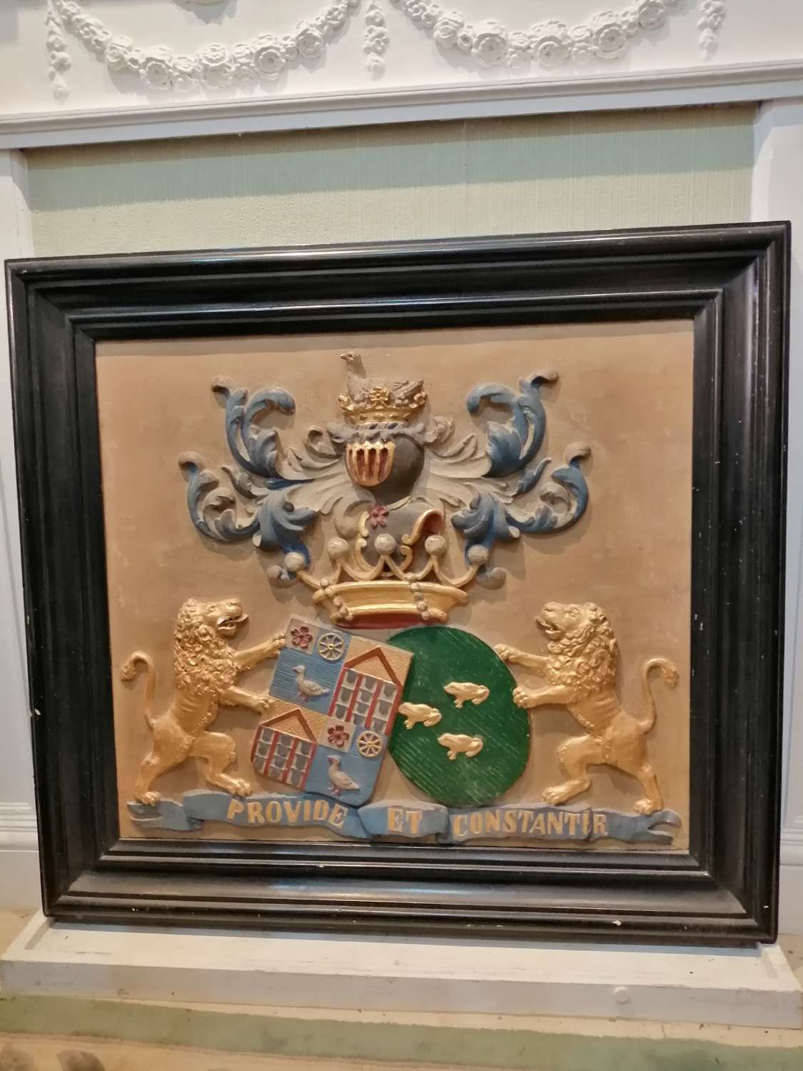 A framed 19th century plaster cast  Coat of Arms