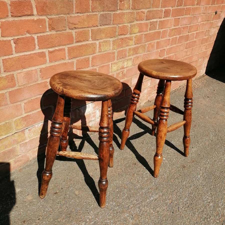 A pair of late 19th century kitchen or bar stools
