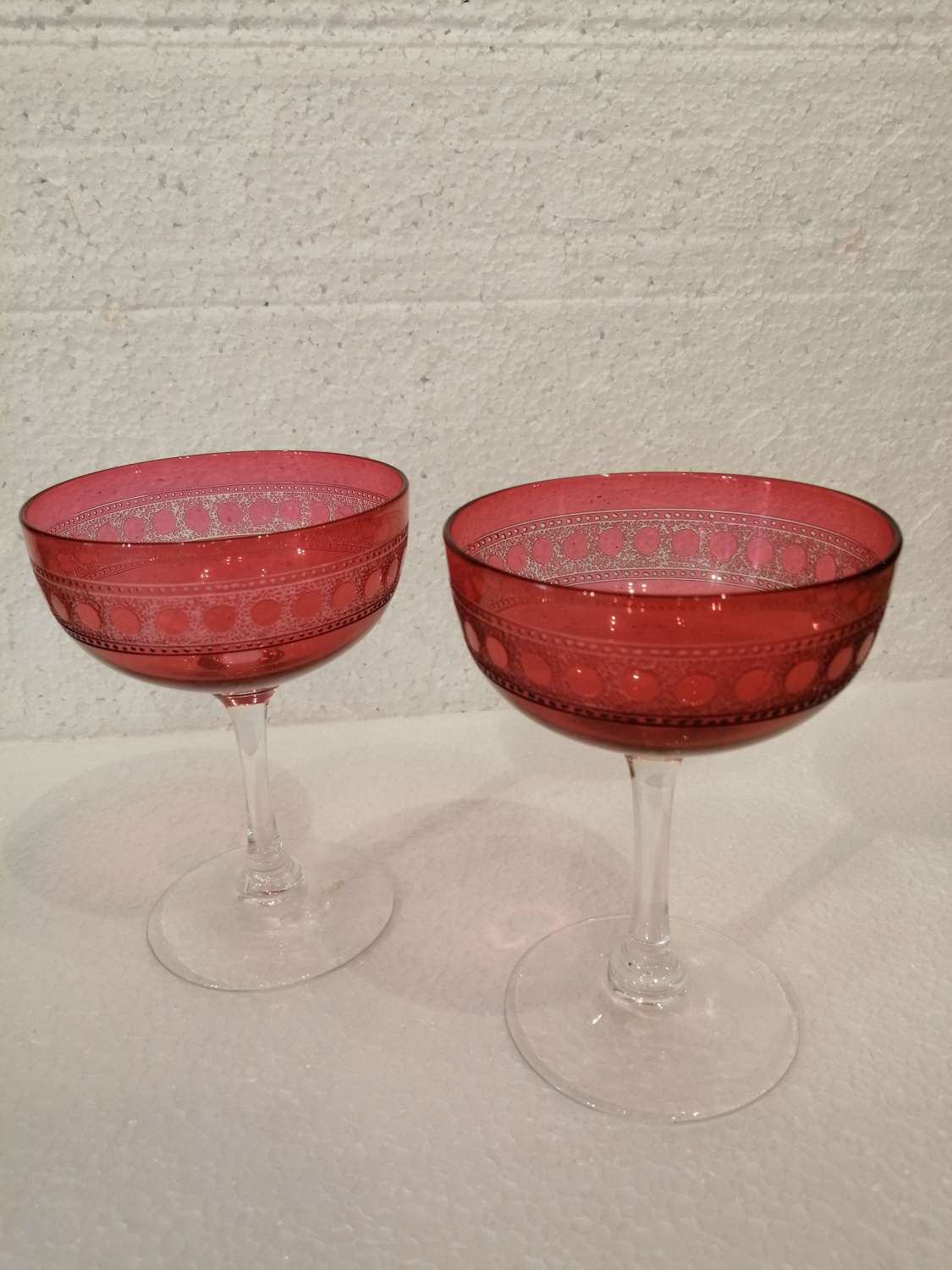 A pair of 19th century cranberry champagne glasses