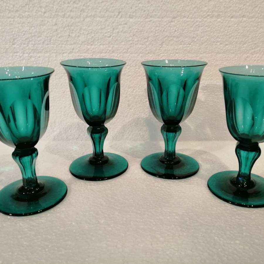 Four Georgian Bristol green wine glasses