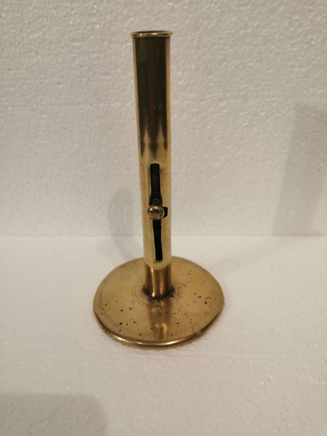 An early 19th century brass hog scraper candlestick