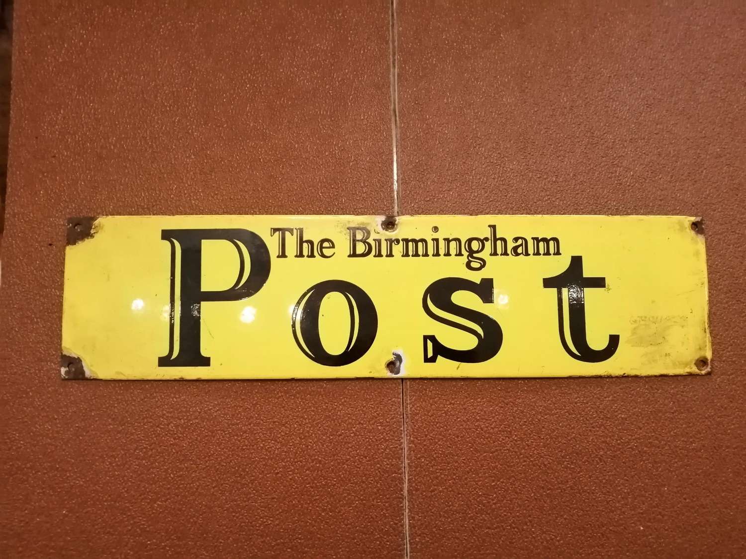 A vintage Birmingham Post advertising sign