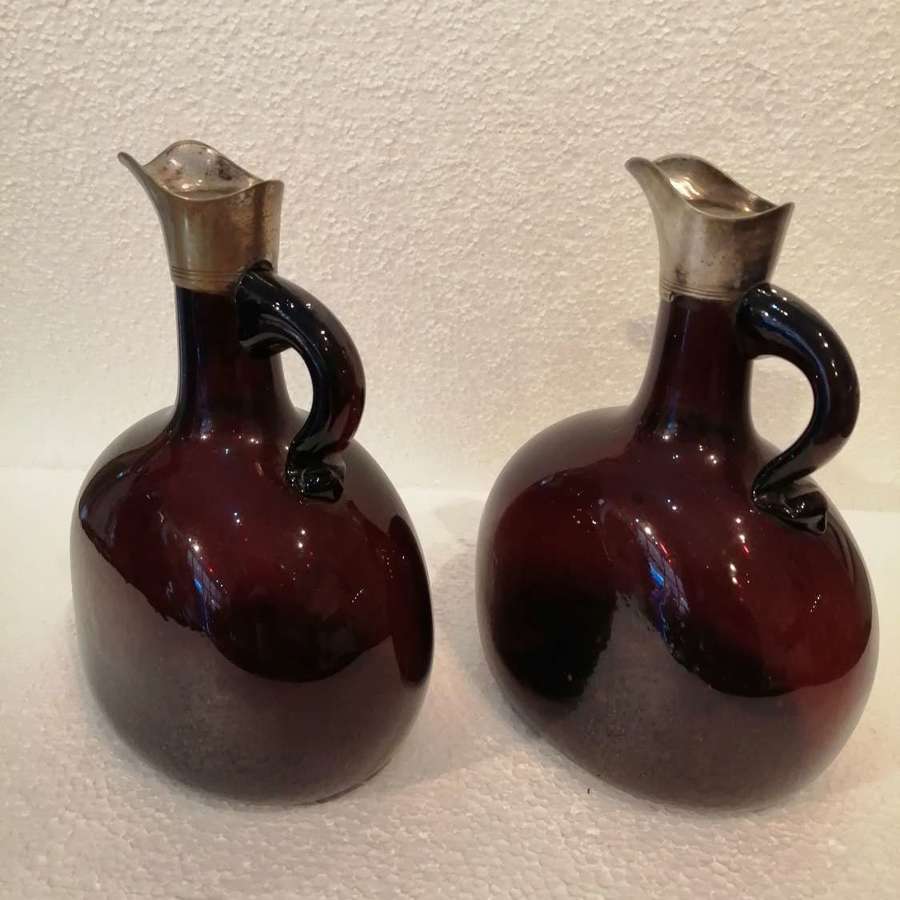 A pair of 19th century dark red spirit decanters