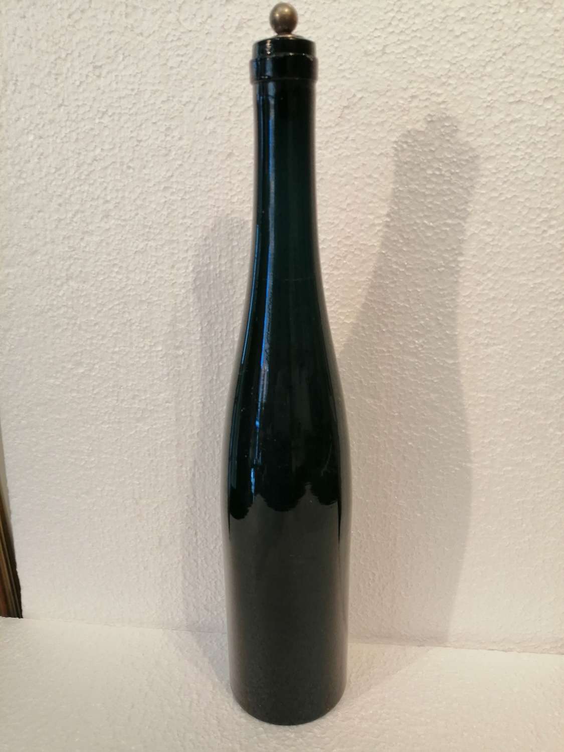 A  tall Georgian green wine bottle