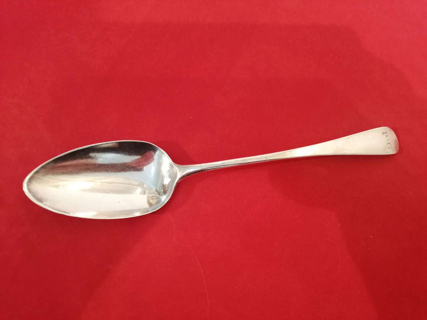 A  Georgian silver serving spoon