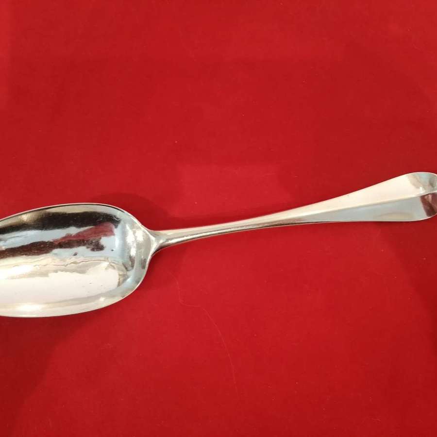 A Queen Anne period silver serving spoon