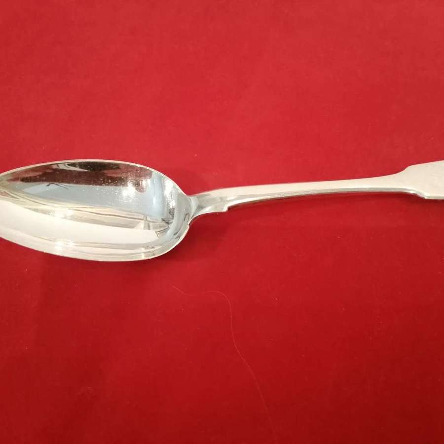 A good late Georgian silver dessert spoon