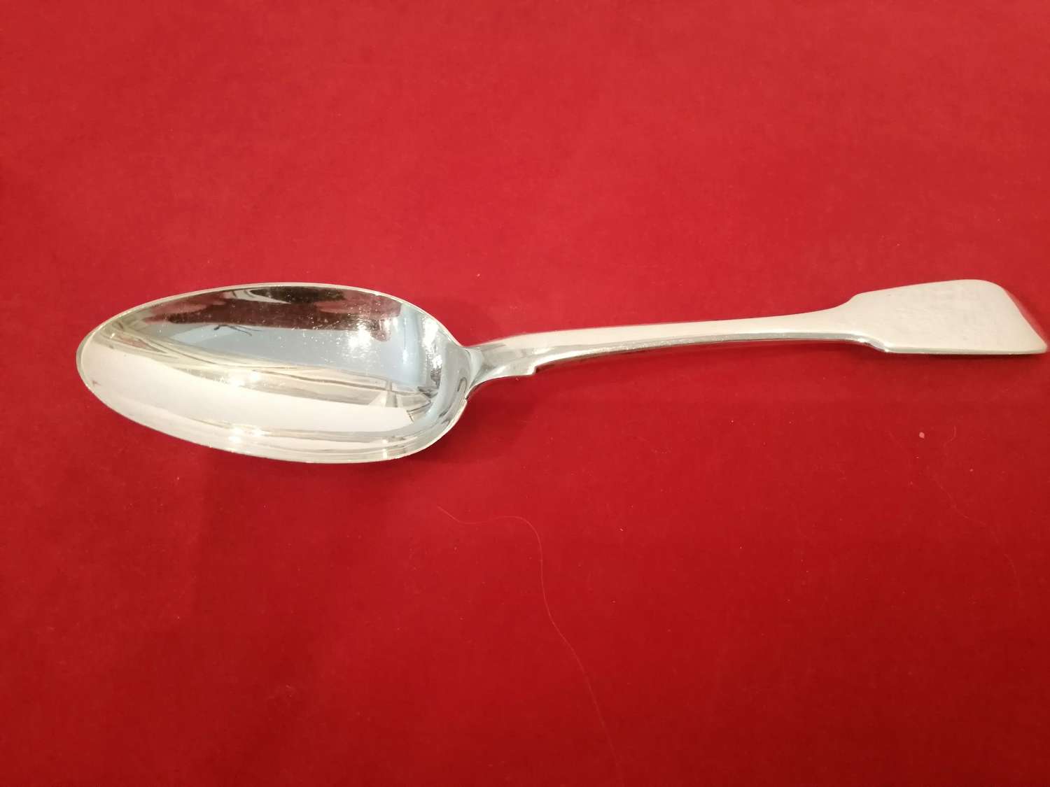 A good late Georgian silver dessert spoon
