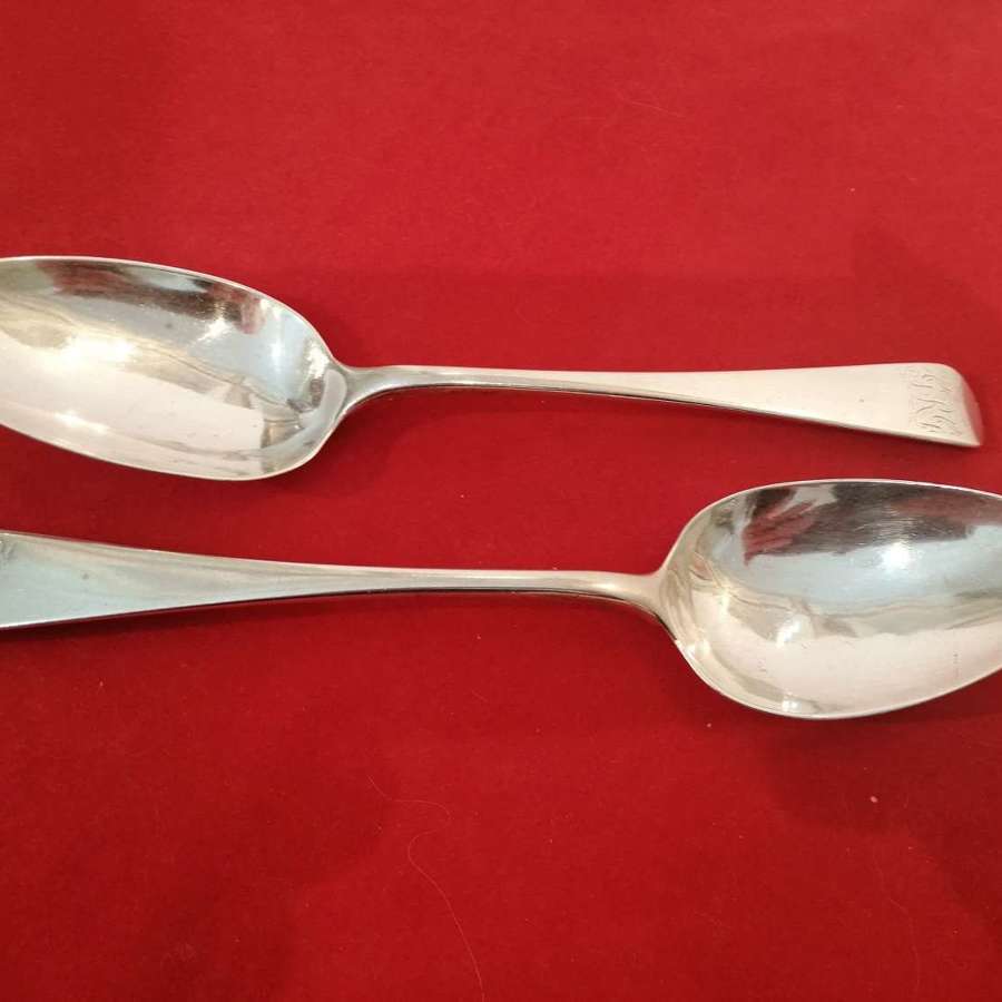 An excellent pair of Georgian silver serving spoons