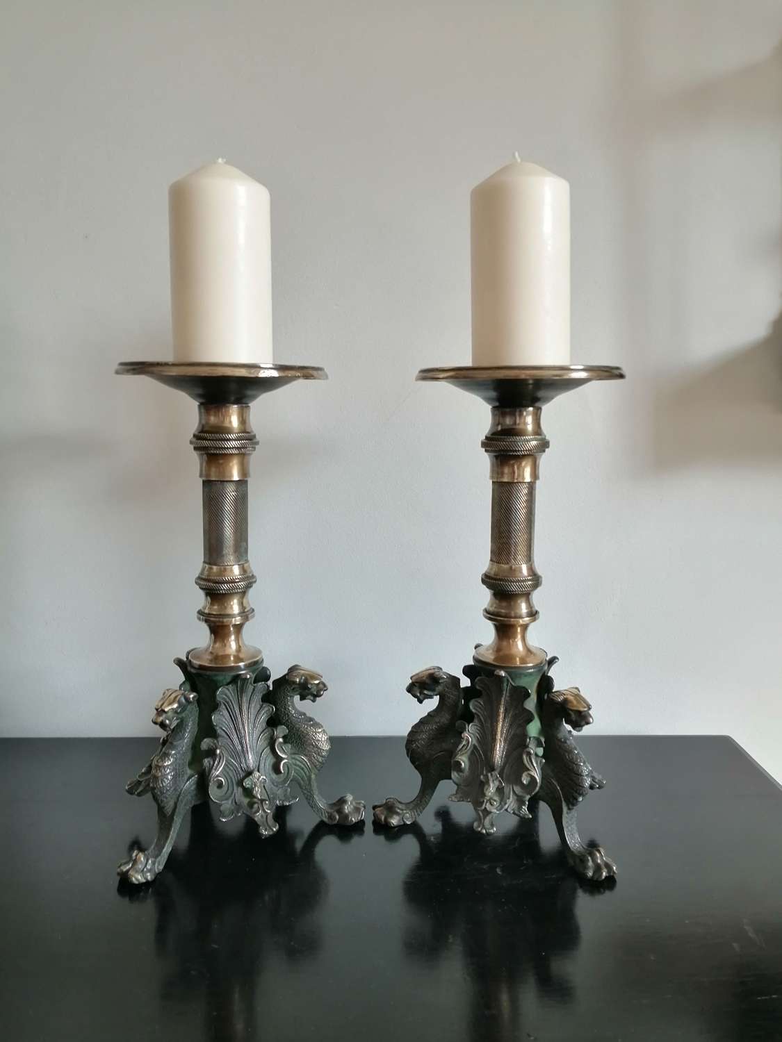 An excellent pair of Egyptian revival pricket candlesticks