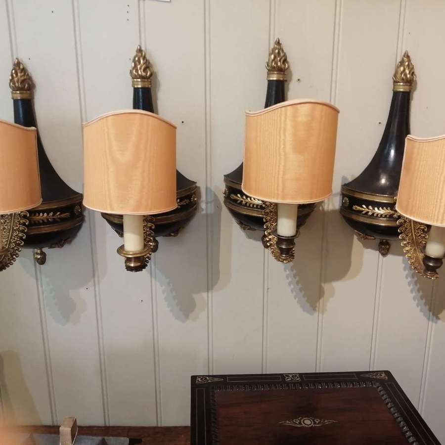A set of four Regency toleware wall lights