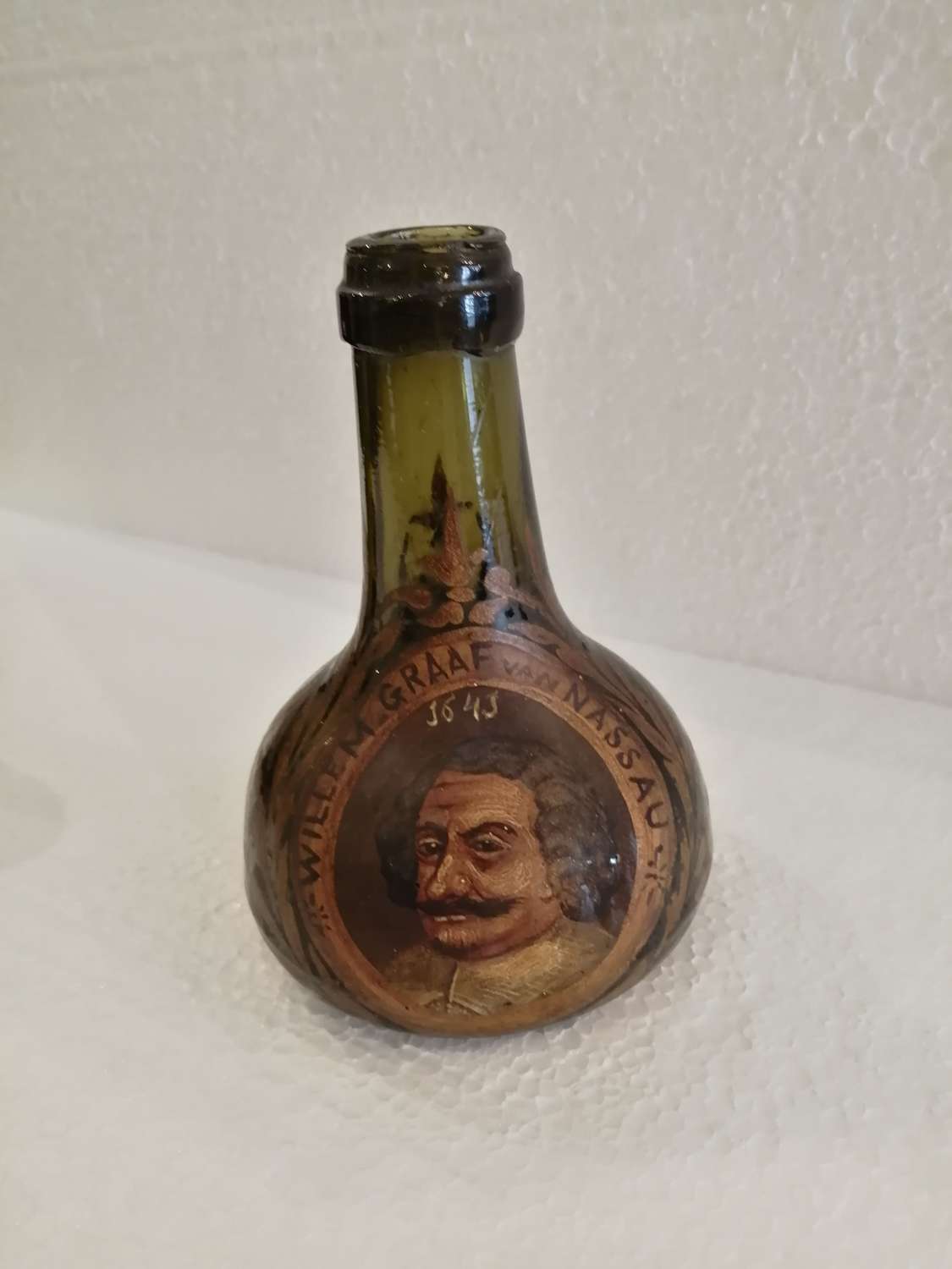 A rare 19th century Dutch decorated green bottle