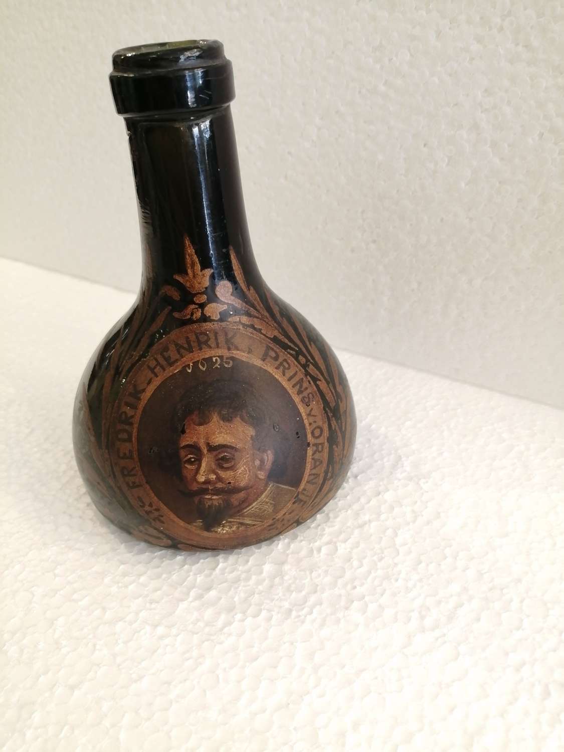 A rare 19th century Dutch decorated green bottle
