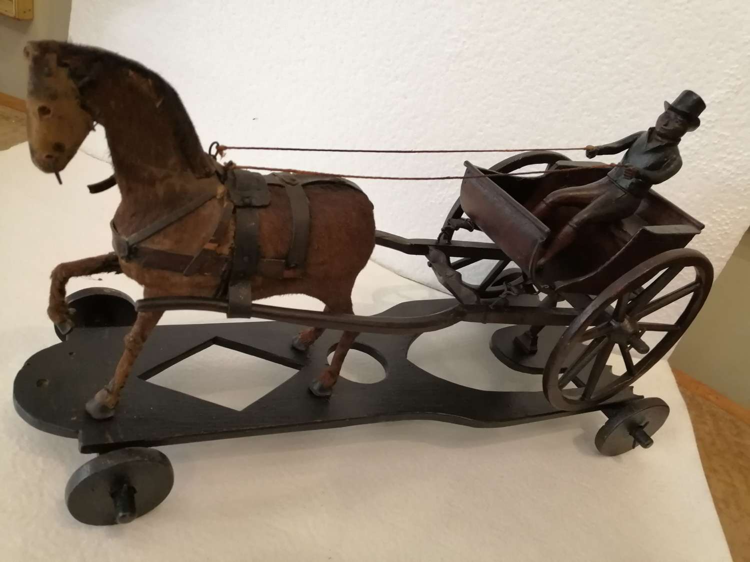 A 19th century folk art model of a horse drawn gig/buggy