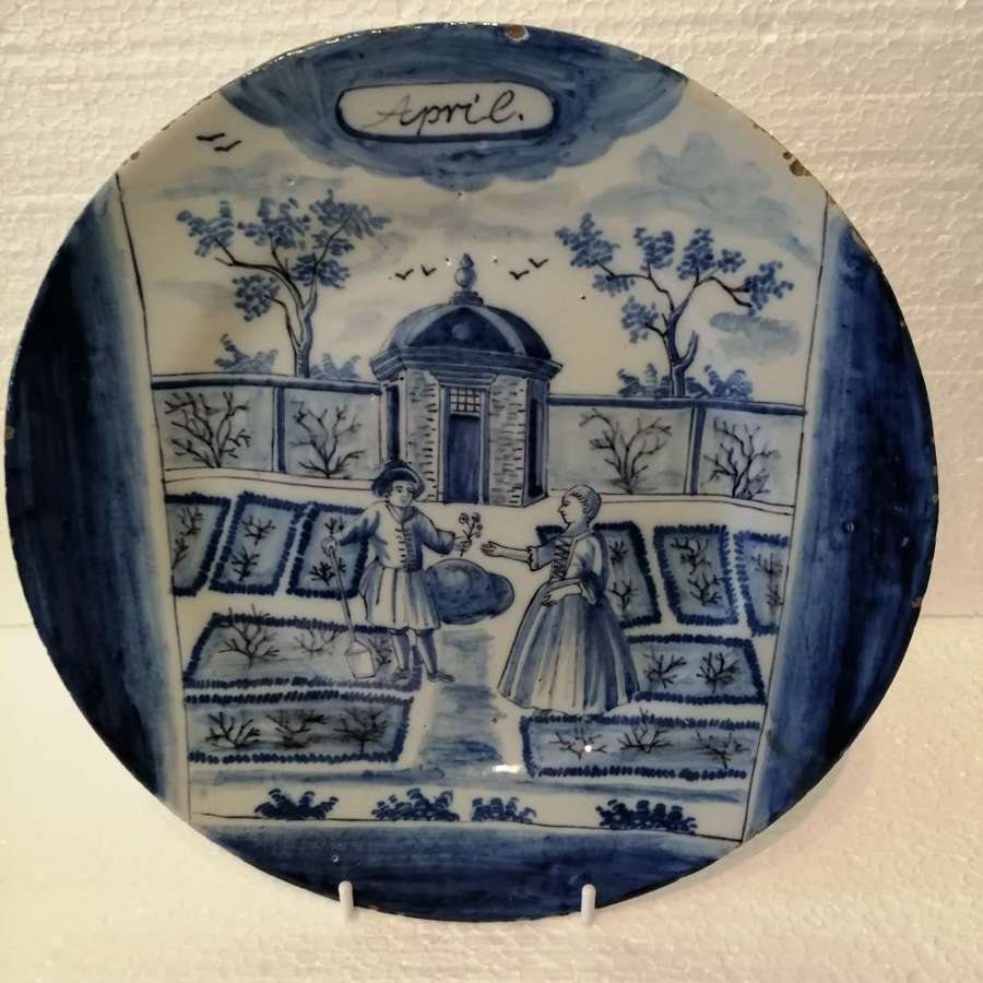 An 18th century Dutch Delft blue & white plate: April