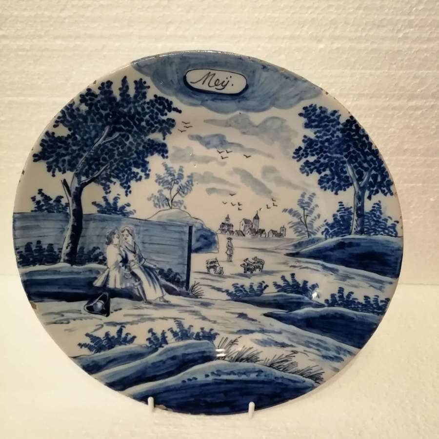 An 18th century Dutch Delft blue & white plate: May