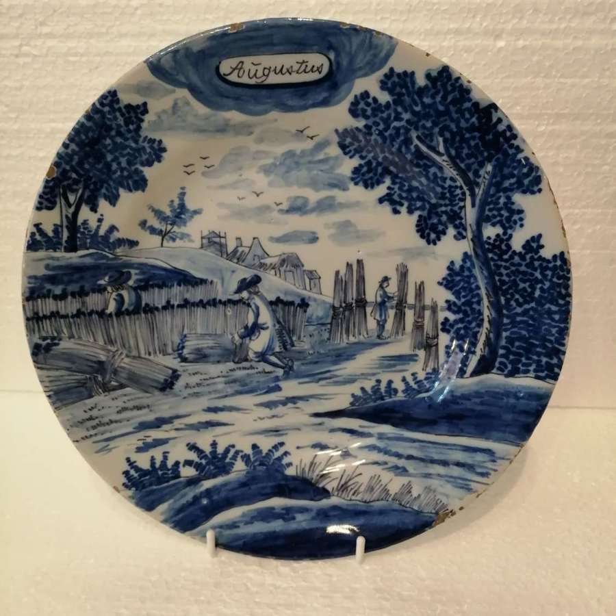 An 18th century Dutch Delft blue & white plate: August