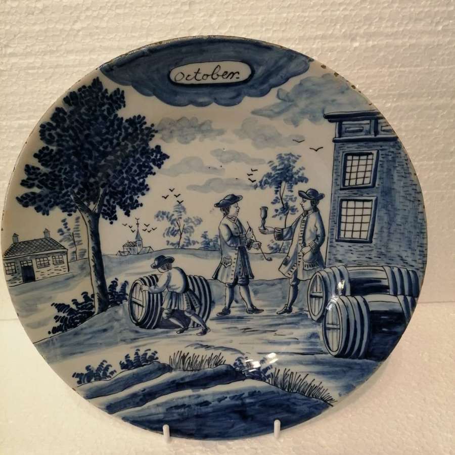 An 18th century Dutch Delft blue & white plate: October