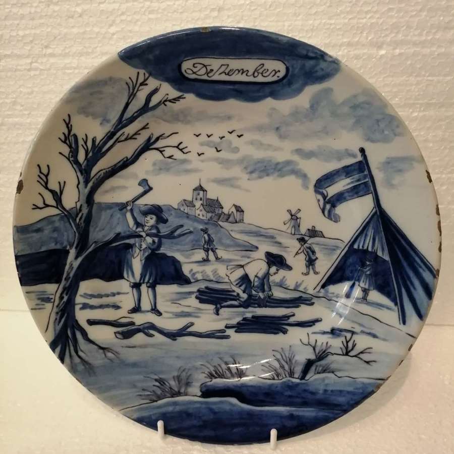 An 18th century Dutch Delft blue & white plate: December