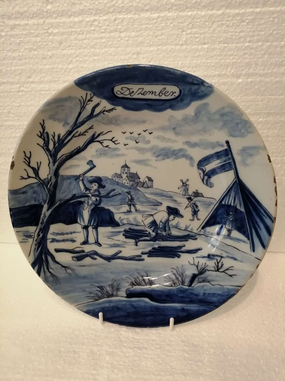 An 18th century Dutch Delft blue & white plate: December