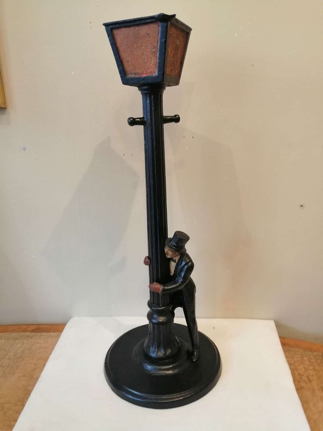 A rare early 20th century cast iron figural candle stand/ashtray