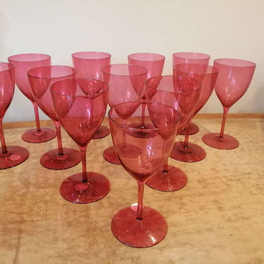 A fine quality set of twelve ( 12 ) late 19th century cranberry wine g